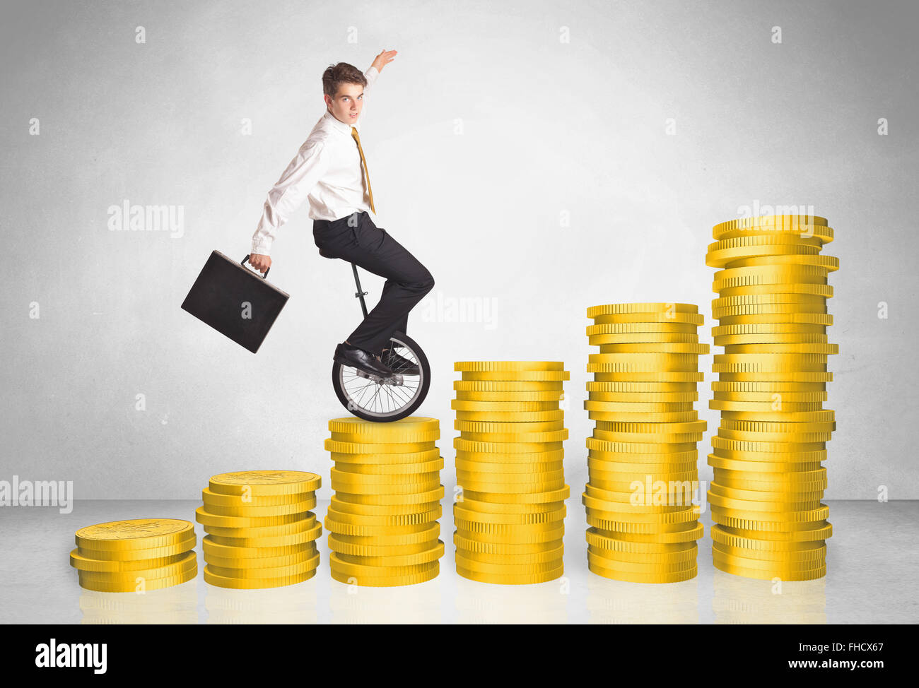 Business man riding monocycle up on coin graph Stock Photo - Alamy