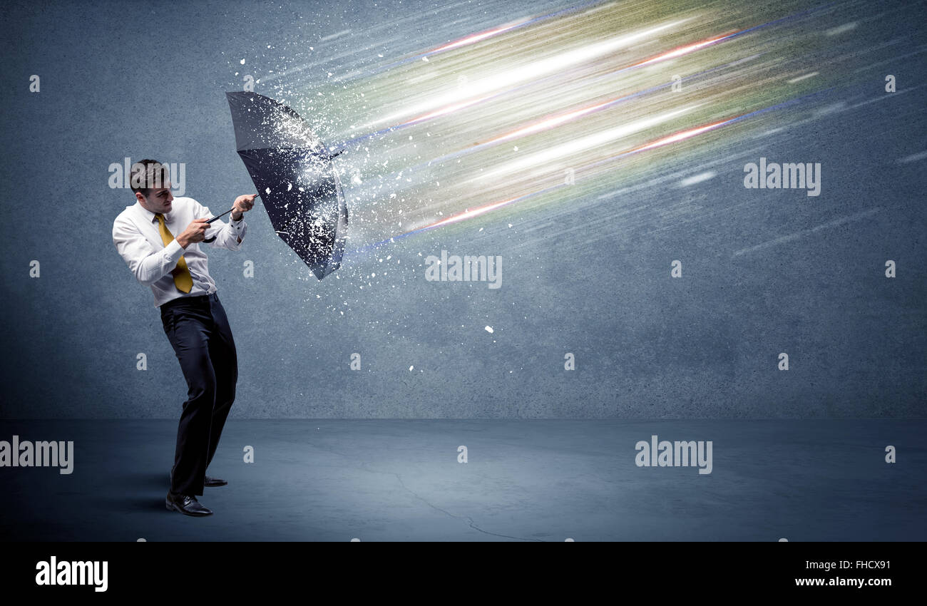 Man Defrending Business man defending light beams with umbrella concept Stock Photo ...