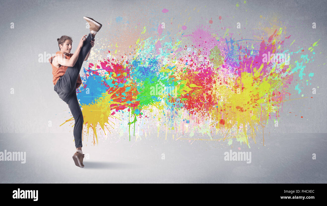 Young colorful street dancer with paint splash Stock Photo - Alamy