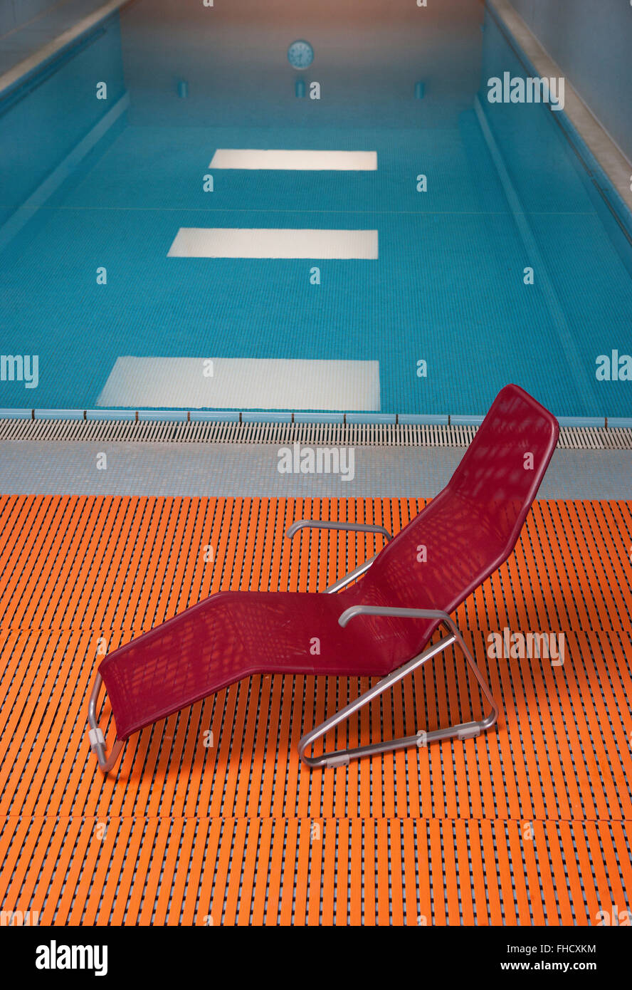 Deckchair at indoor swimming pool Stock Photo