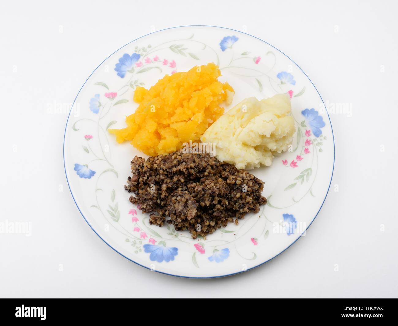 Traditional Scottish dish of Haggis mashed turnip and mashed potatoes. Stock Photo