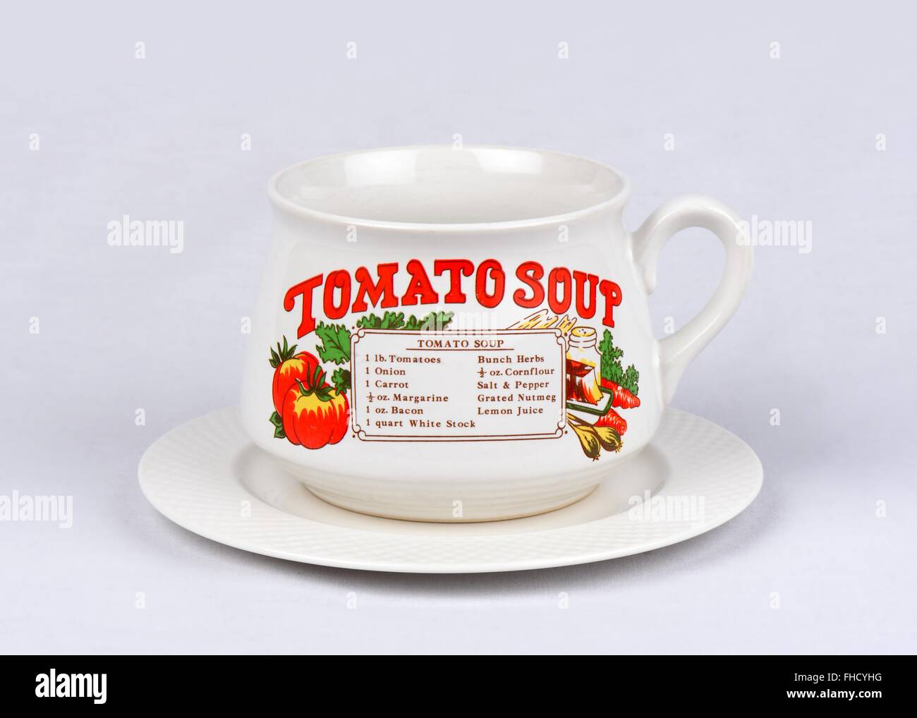 Soup cup with a Tomato soup recipe printed on the front. Stock Photo