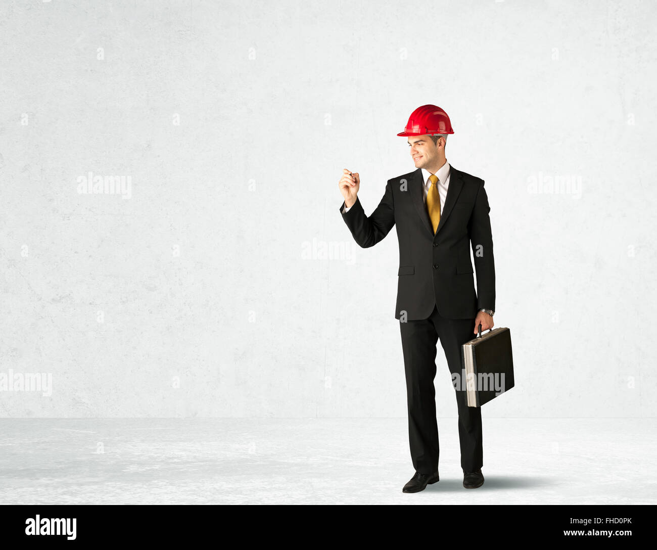 Young architect drawing in empty space Stock Photo - Alamy