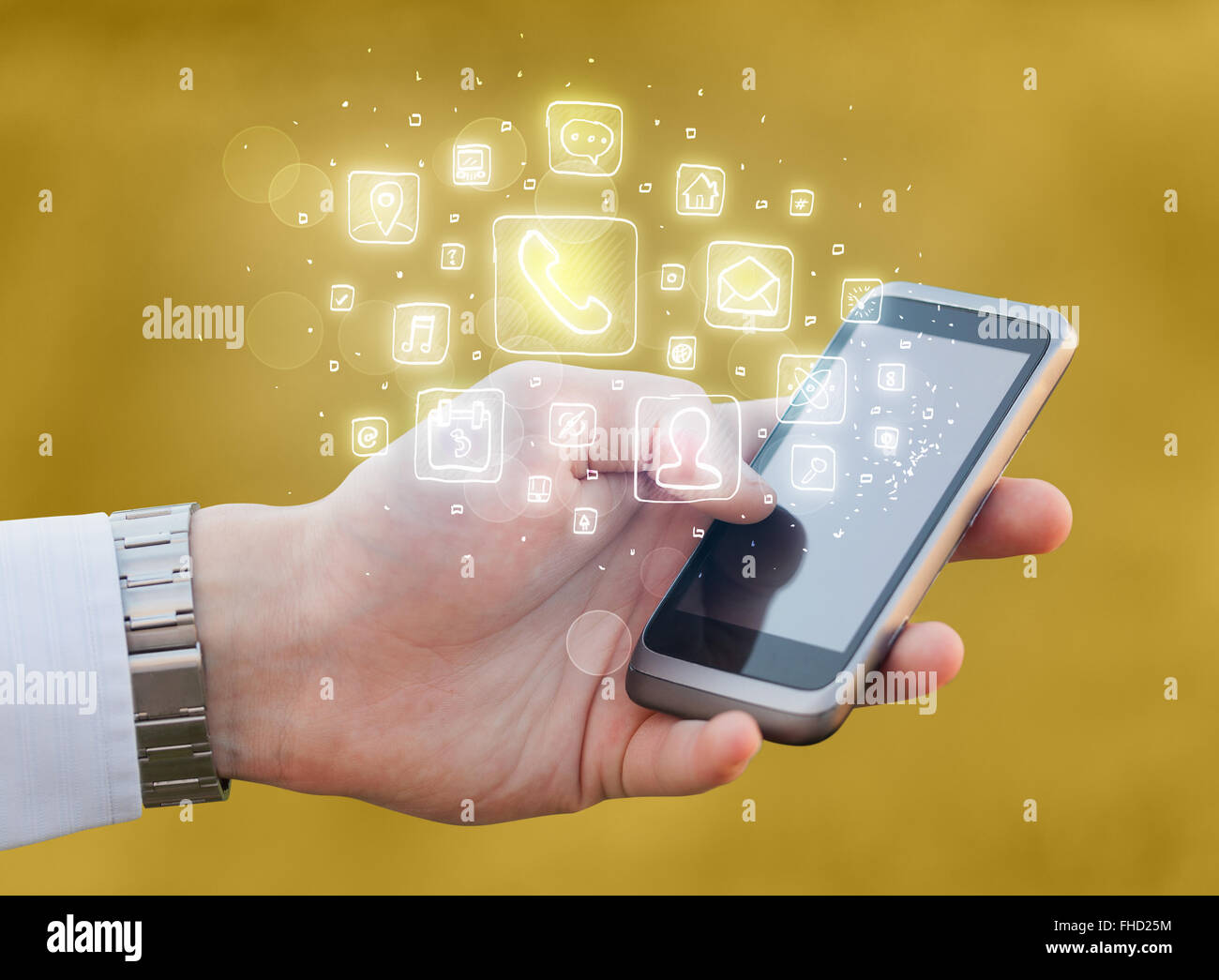 Hand holding smartphone with mobile app icons Stock Photo - Alamy