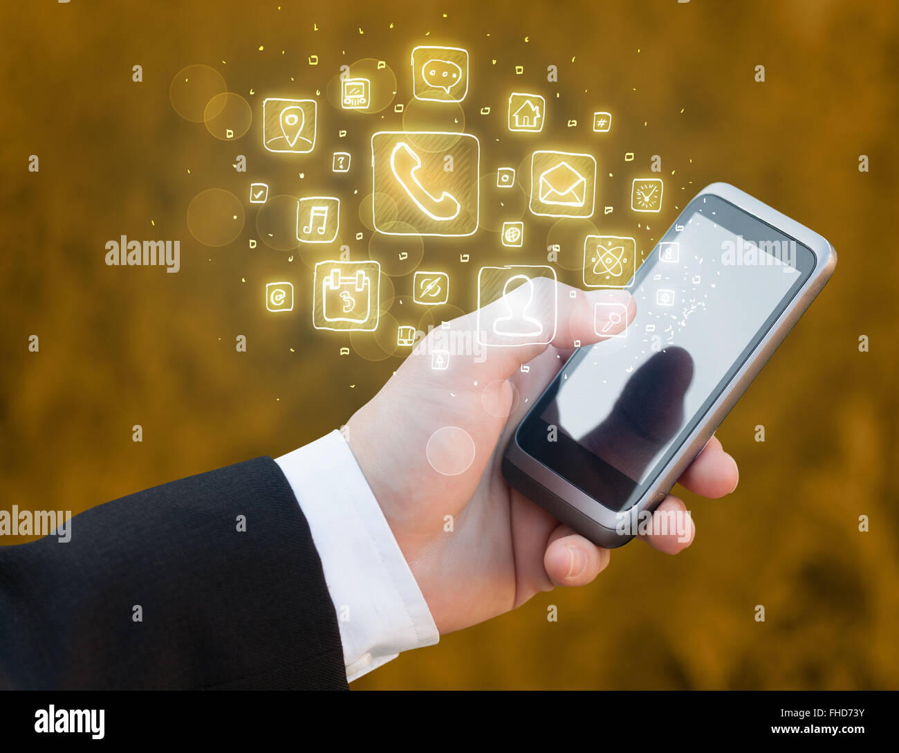 Hand holding smartphone with mobile app icons Stock Photo - Alamy