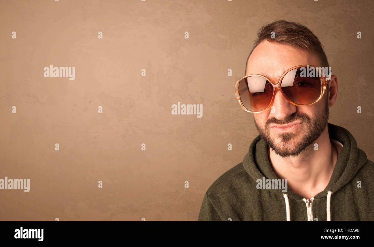 Portrait of a young funny man with sunglasses and copyspace Stock Photo