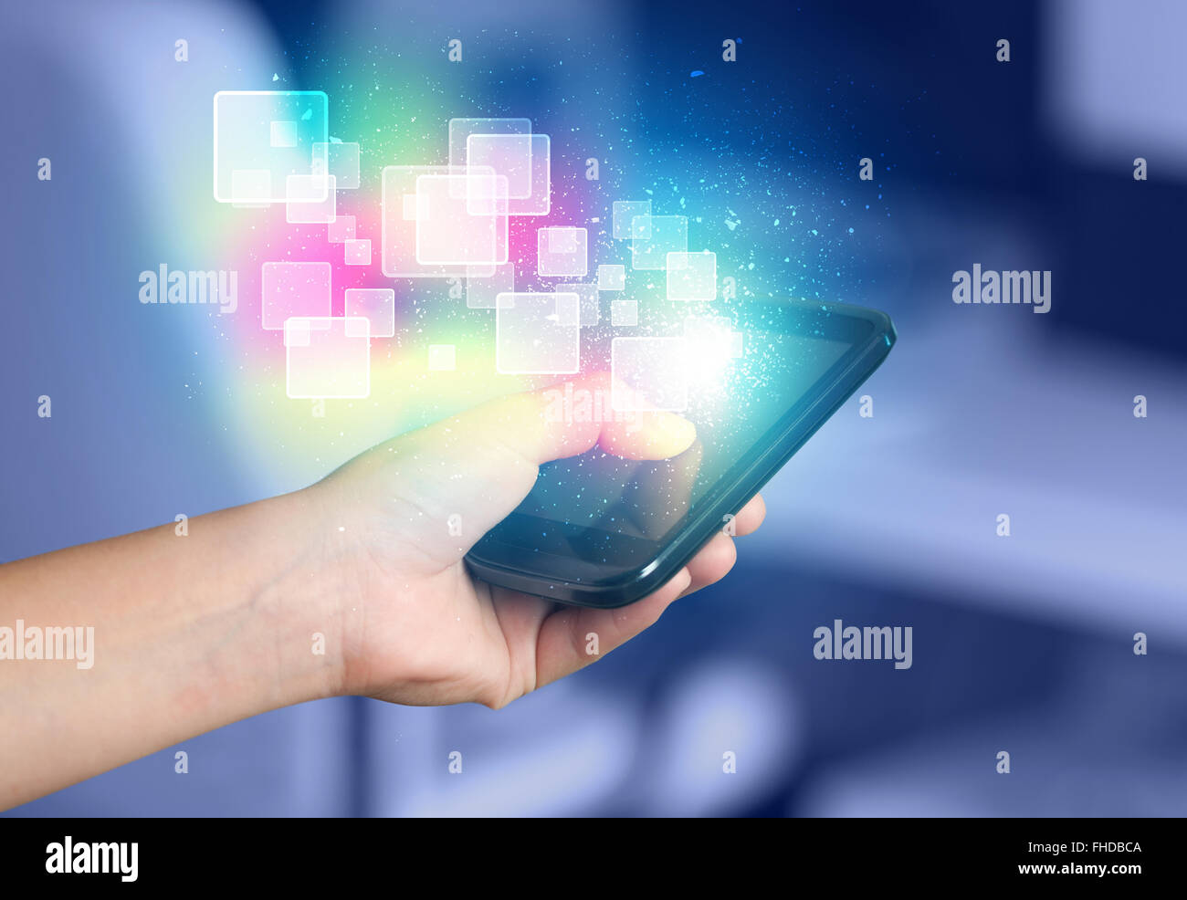Hand holding smart phone with abstract glowing squares Stock Photo - Alamy