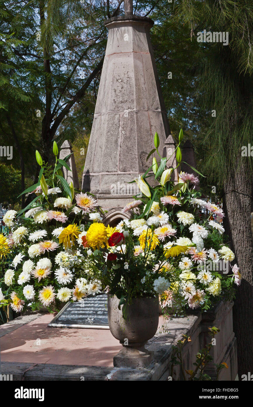 GRAVES are covered with FRESH FLOWERS to loved ones back to earth during DAY OF THE DEAD