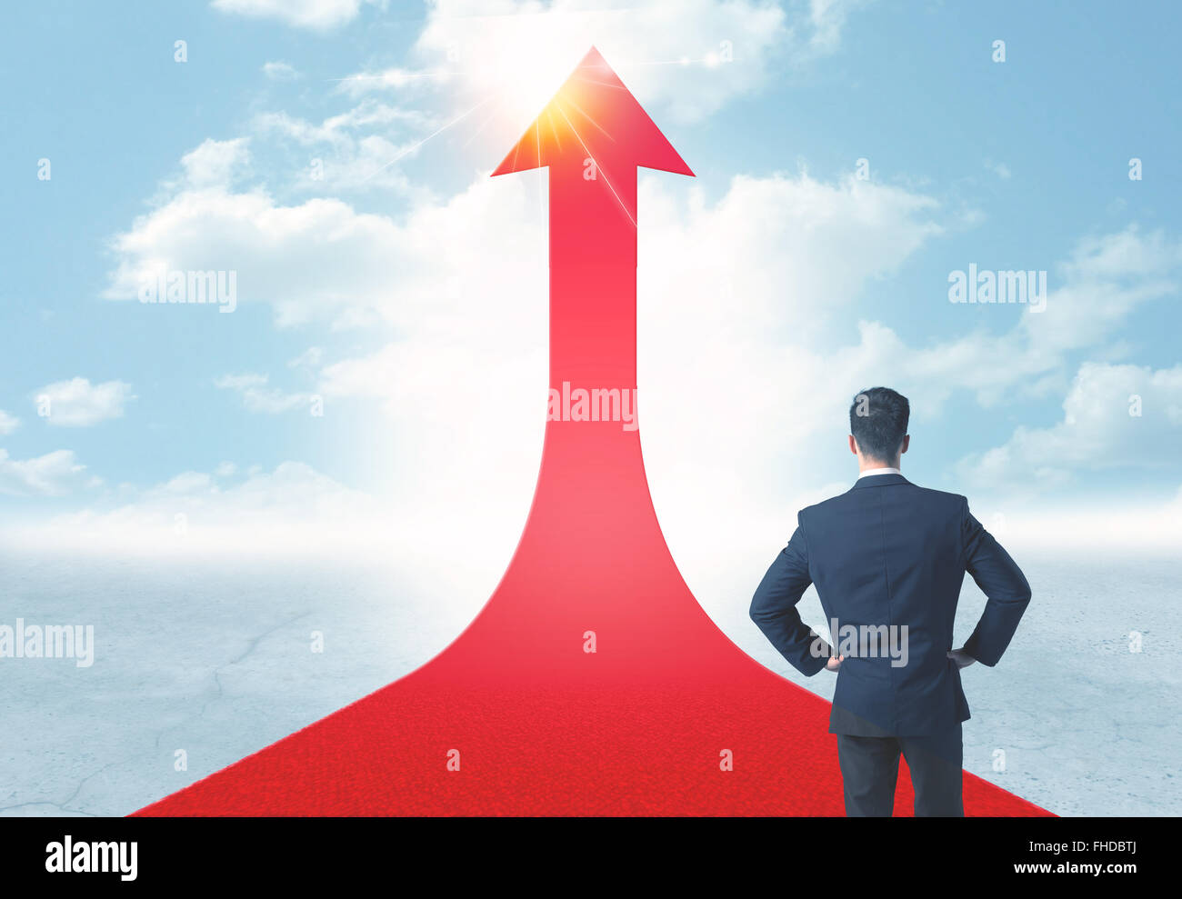 businessman standing on a red arrow Stock Photo - Alamy
