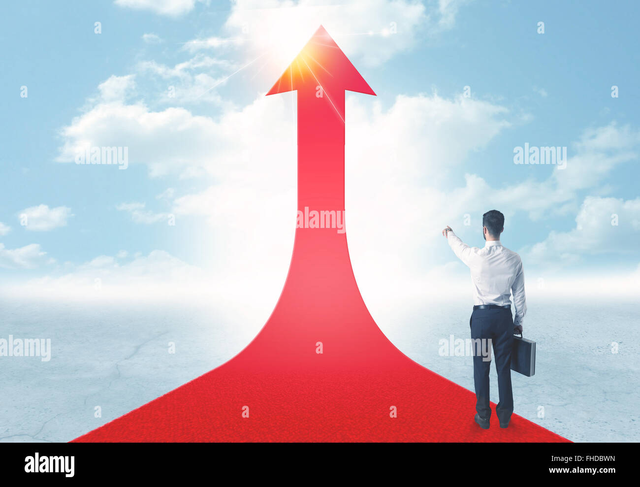businessman standing on a red arrow Stock Photo - Alamy