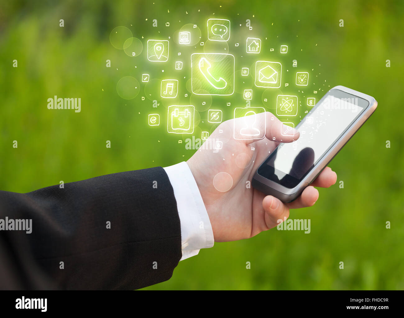 Hand holding smartphone with mobile app icons Stock Photo - Alamy