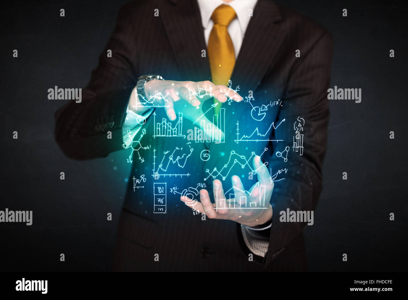 holding hand drawn business diagrams Stock Photo