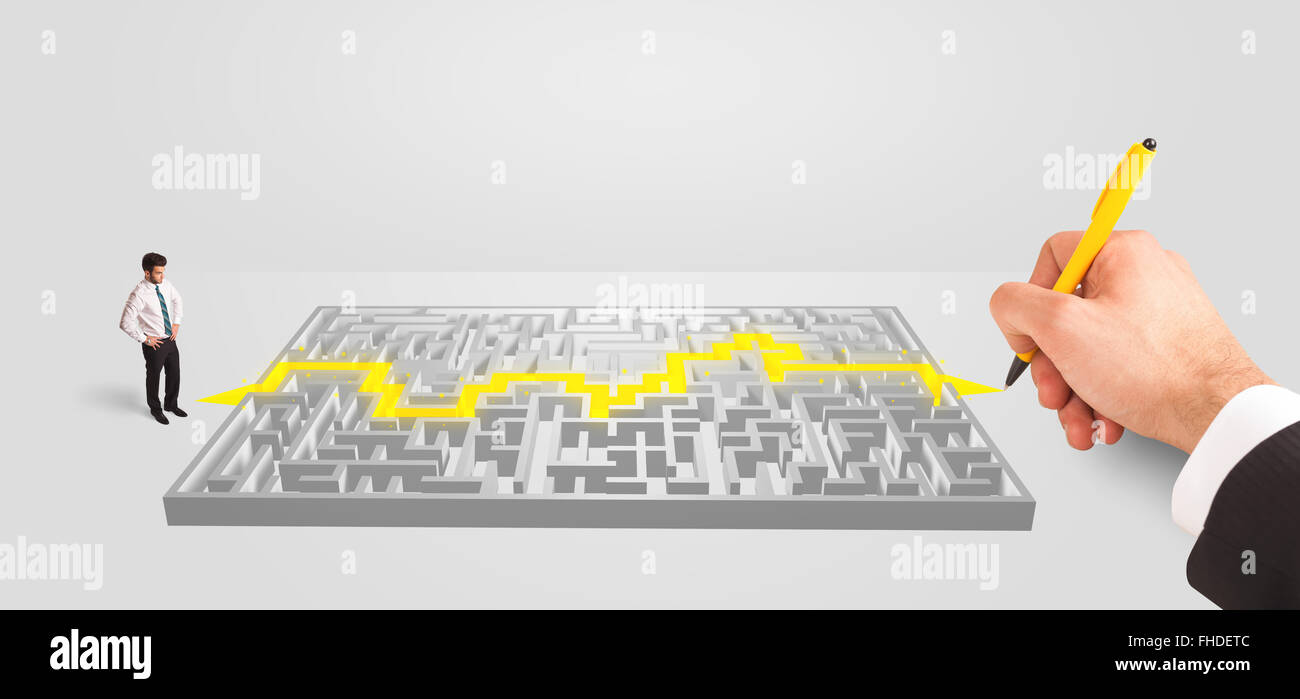 Businessman in front of a maze with solution Stock Photo - Alamy