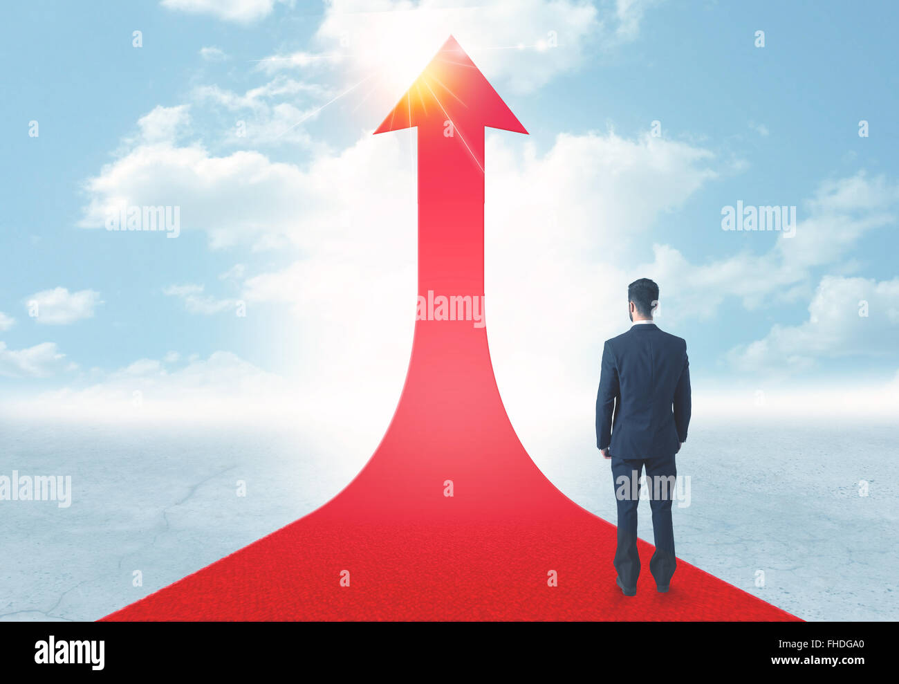 businessman standing on a red arrow Stock Photo - Alamy