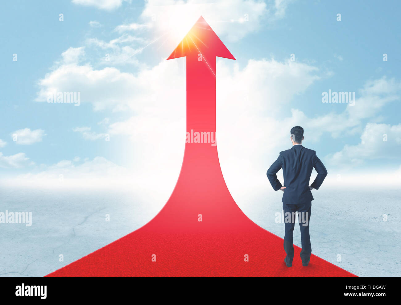 businessman standing on a red arrow Stock Photo - Alamy