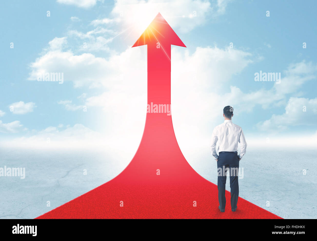 businessman standing on a red arrow Stock Photo - Alamy