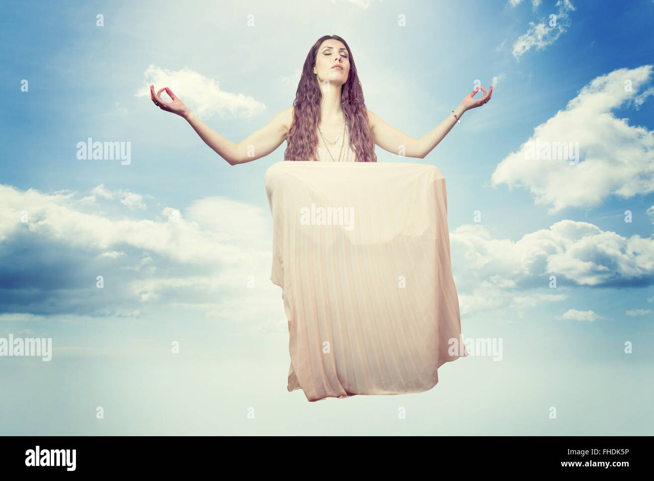 Composite image of portrait of woman levitating with eyes closed Stock Photo