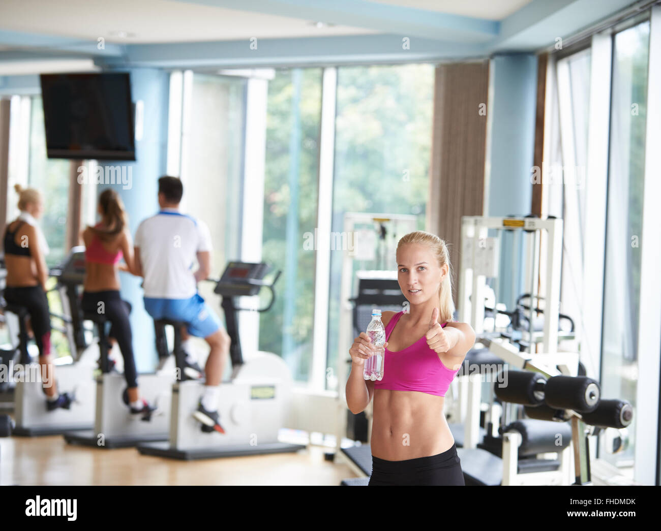woman in fitness gym drink water Stock Photo - Alamy