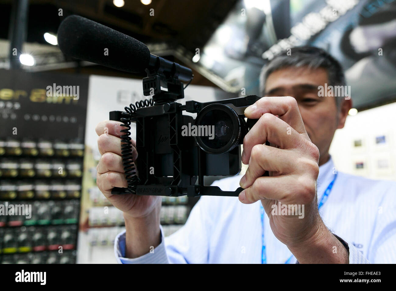 Yokohama, Japan. 25th February, 2016. A exhibitor holds a Beast Grip Pro steadicam for smartphone at the CP  2016 Camera & Imaging Show on February 25, 2016, in Yokohama, Japan. CP  is the biggest camera and photo imaging showcase in Japan with 132 exhibitors across 1,073 booths in Osanbashi Hall and Pacifico Yokohama, and organizers expect 70,000 visitors over the course of the exhibition that runs until Sunday 28th. Credit:  Rodrigo Reyes Marin/AFLO/Alamy Live News Stock Photo