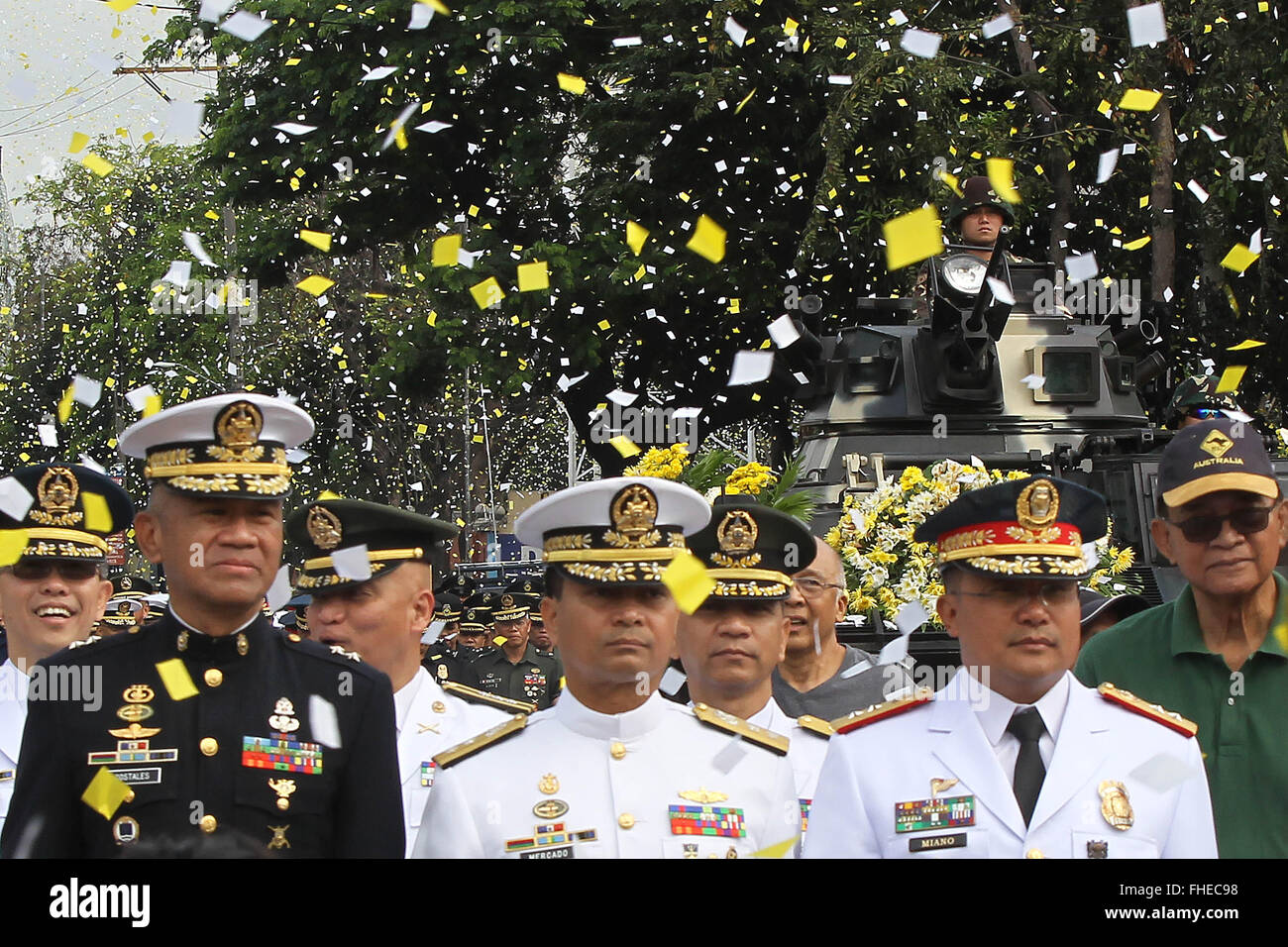 Quezon City, Philippines. 25th Feb, 2016. Confetti rains down on military officers during the 30th anniversary of the People Power Revolution in Quezon City, the Philippines, Feb. 25, 2016. Filipinos on Thursday celebrated the 30th anniversary of the People Power Revolution, an event that toppled the dictatorship of former President Ferdinand Marcos in 1986. Credit:  Rouelle Umali/Xinhua/Alamy Live News Stock Photo