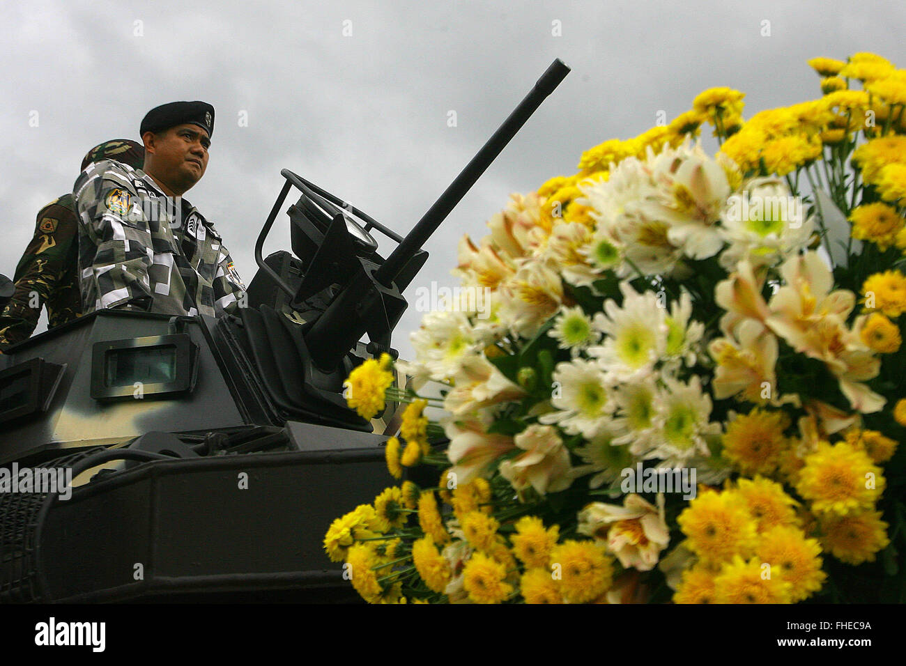 Quezon City, Philippines. 25th Feb, 2016. Soldiers on a tank participate in the 30th anniversary of the People Power Revolution in Quezon City, the Philippines, Feb. 25, 2016. Filipinos on Thursday celebrated the 30th anniversary of the People Power Revolution, an event that toppled the dictatorship of former President Ferdinand Marcos in 1986. Credit:  Rouelle Umali/Xinhua/Alamy Live News Stock Photo
