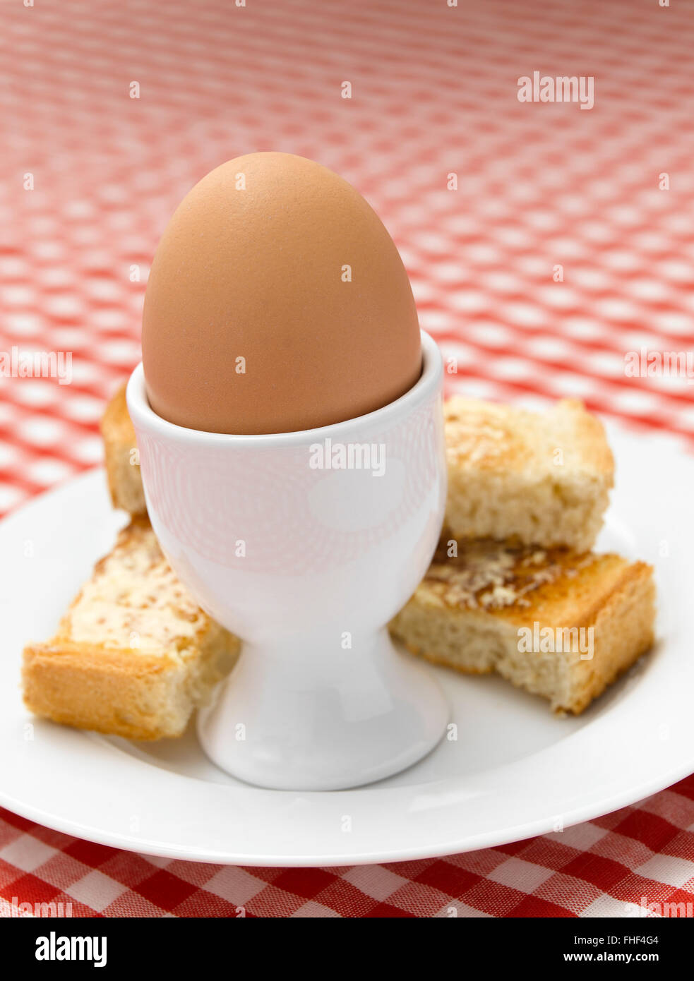 Boiled Egg on Gingham tablecloth Stock Photo