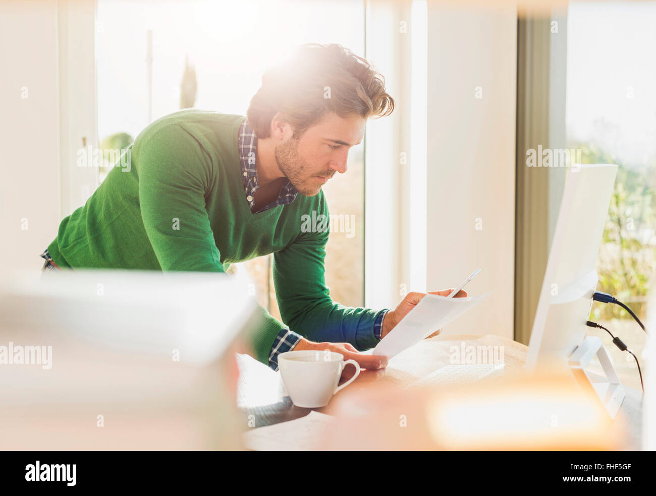 Young man working at home office Stock Photo