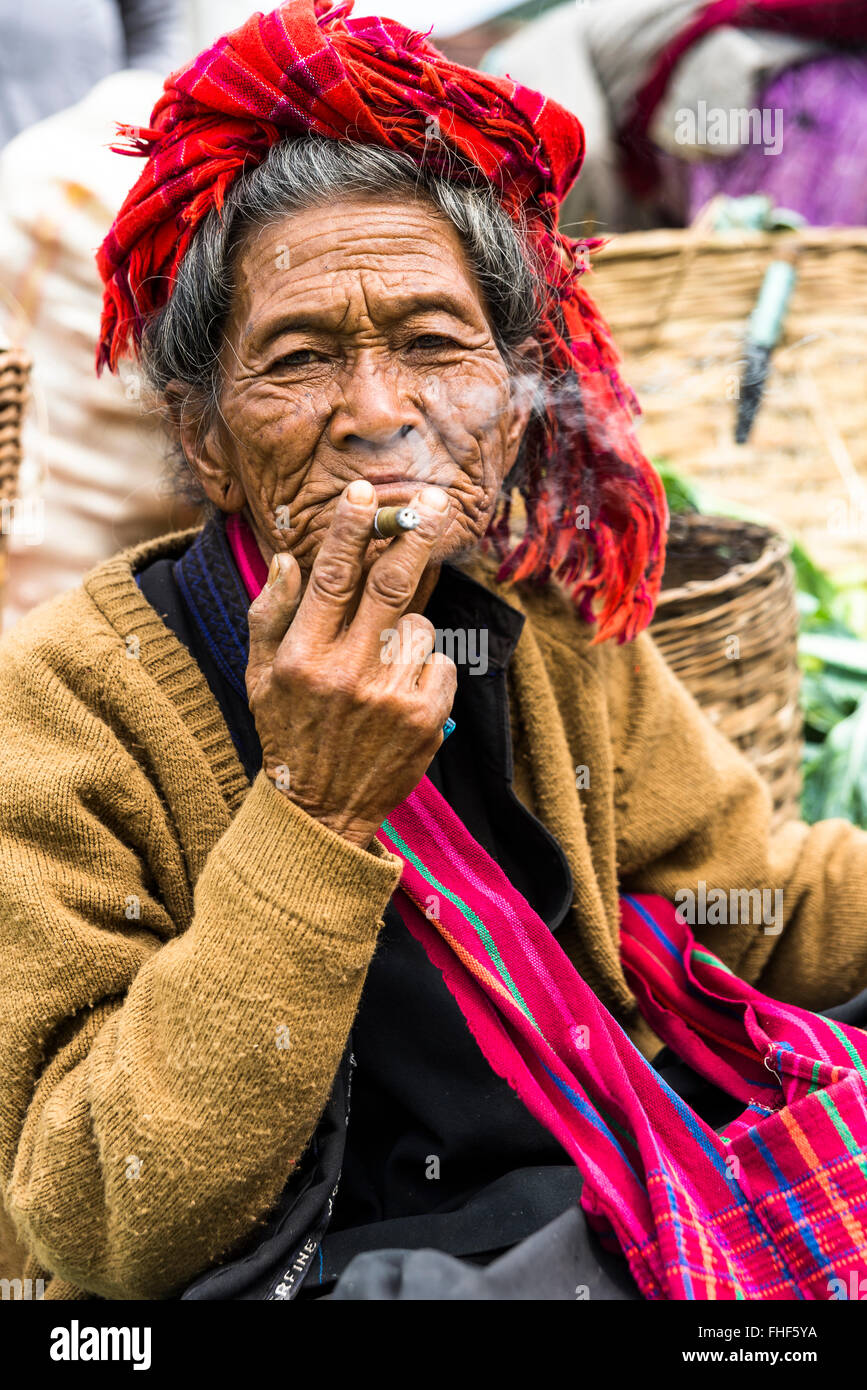 Smoking old woman from the Pao hilltribe or mountain people, portrait, market, Kalaw, Shan State, Myanmar, Burma Stock Photo
