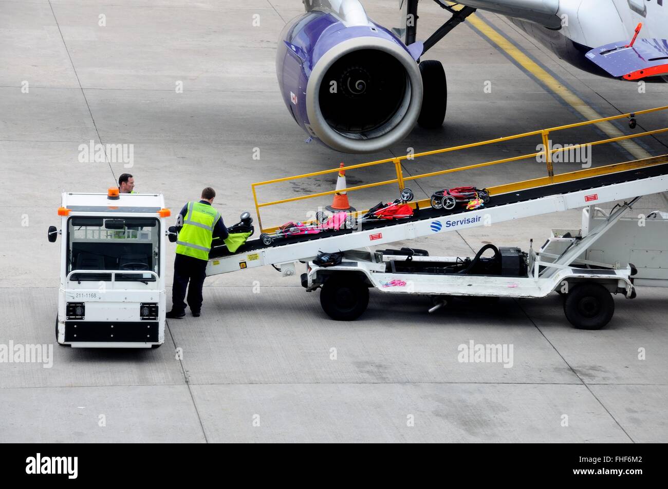 Bags being loaded onto aircraft on a conveyer belt at Birmingham