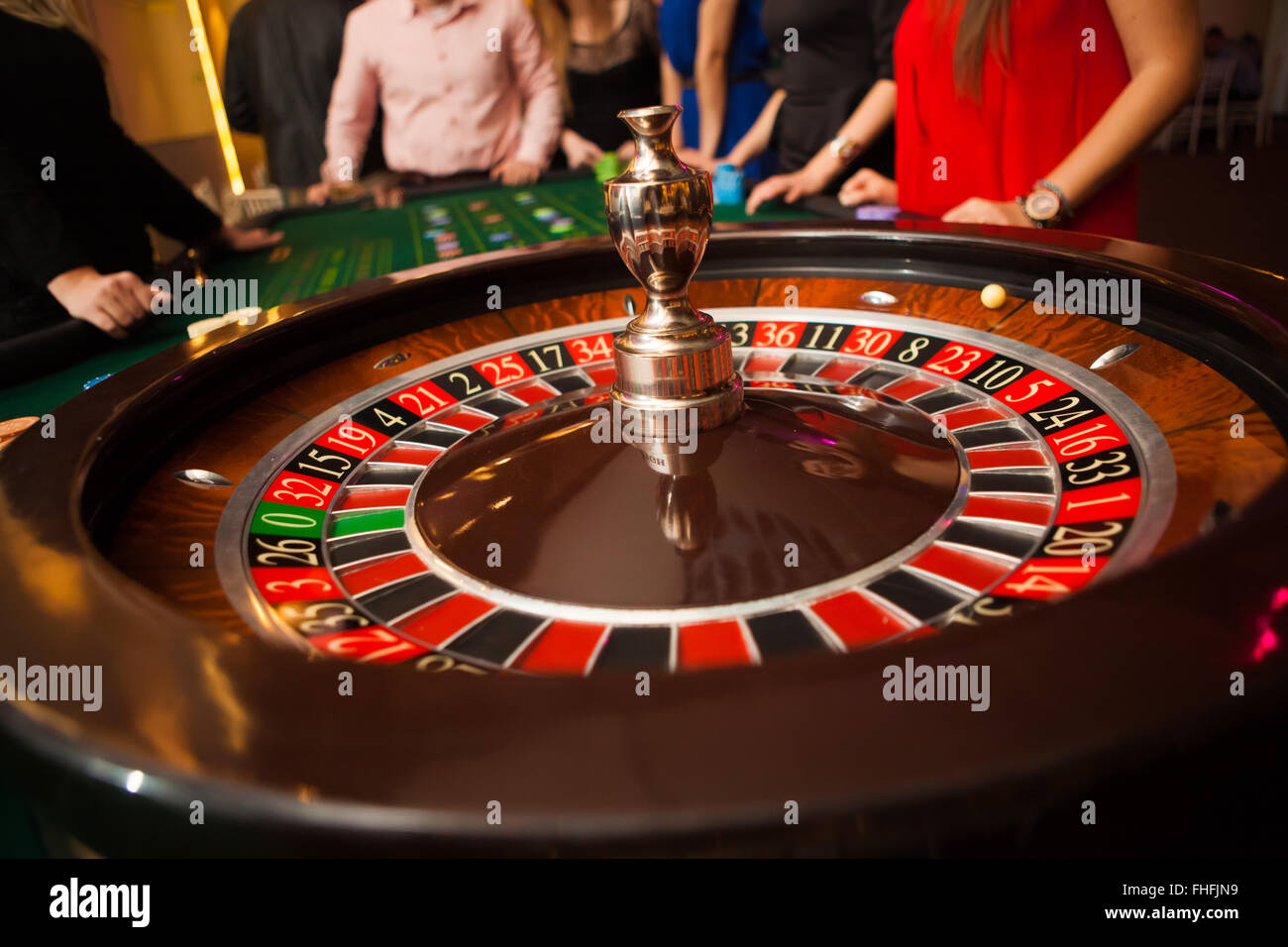 green roulette table with collored chips ready to play Stock Photo