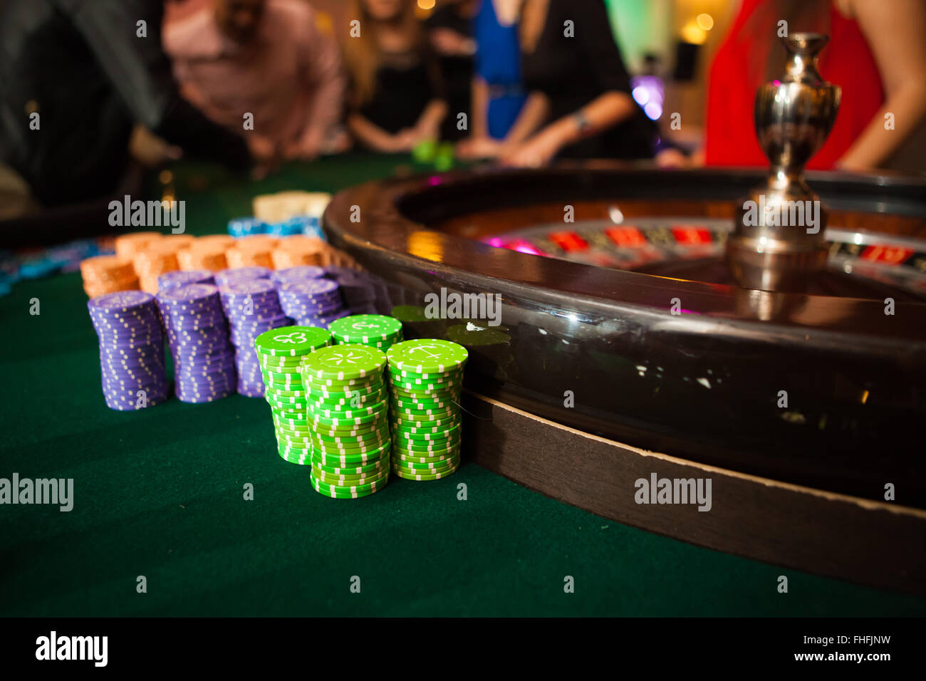 green roulette table with collored chips ready to play Stock Photo Alamy
