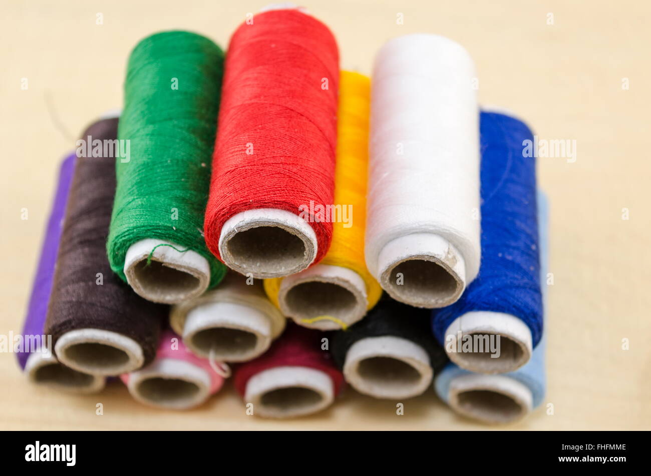 Sewing thread in various colors on a pile Stock Photo