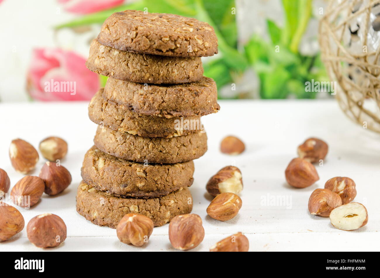 Pile of integral cookies and hazelnuts Stock Photo