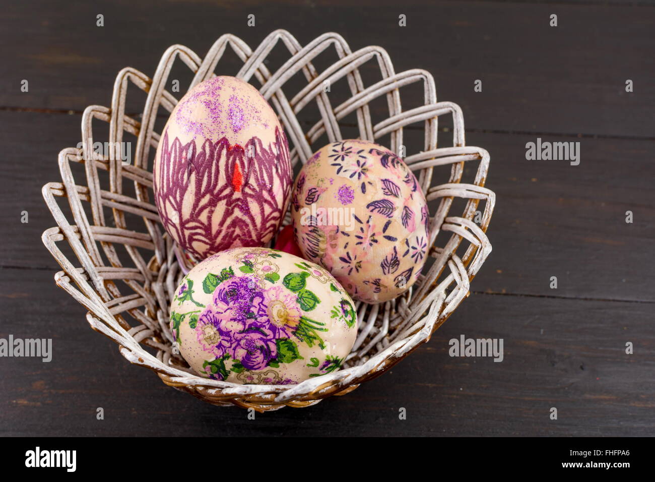 Colorful painted and decorated Easter eggs in a basket Stock Photo - Alamy