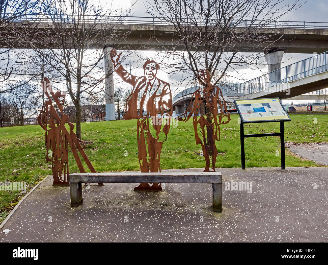 The Anderston Foot Bridge (right) in the Anderston area of Glasgow Scotland beside the M8 with sculptures of local heroes Stock Photo