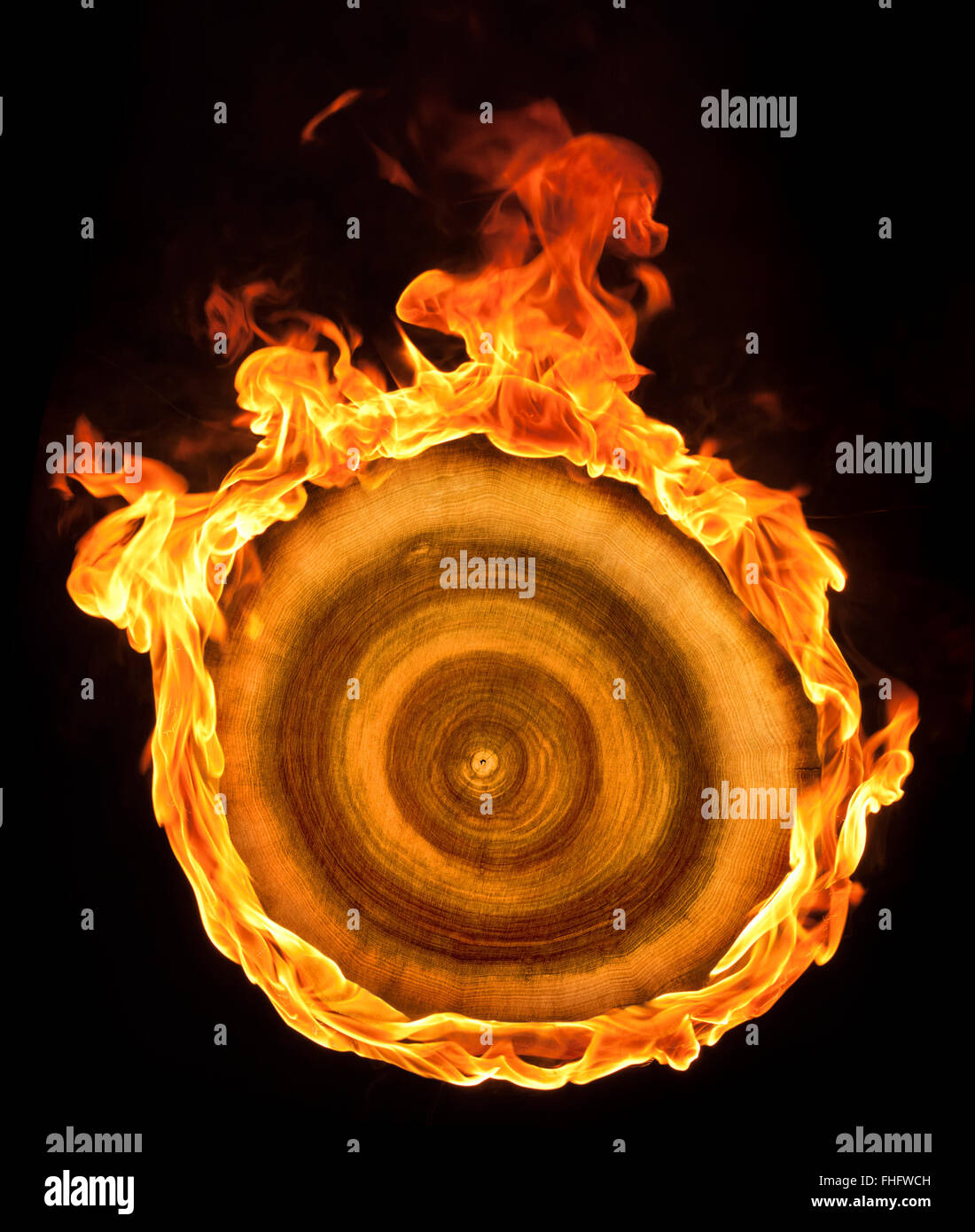 a burning wooden sheave in black back Stock Photo