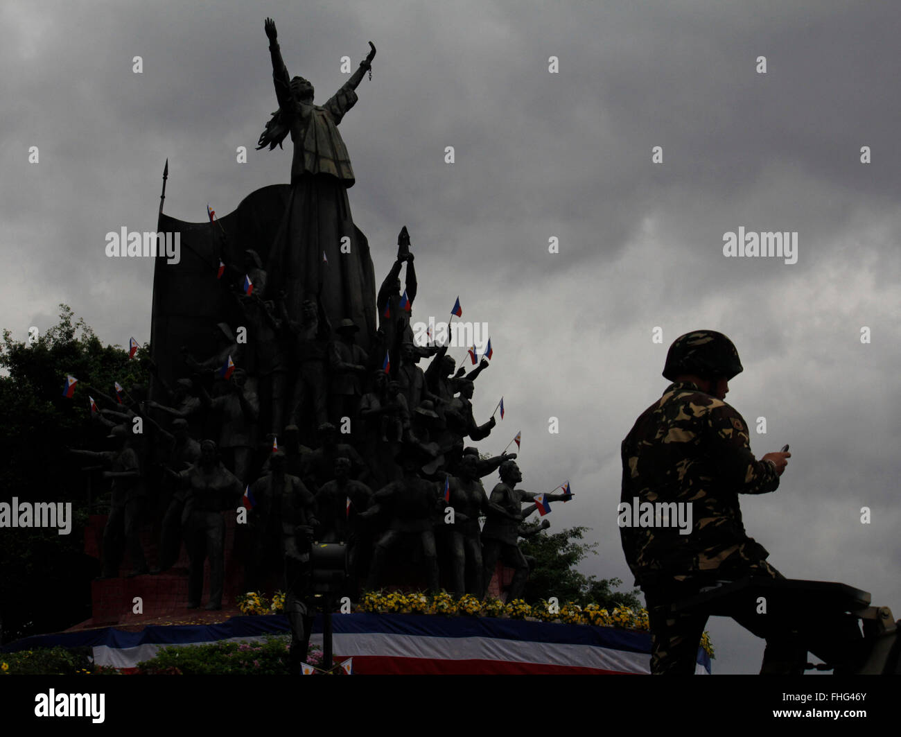 A Filipino soldier stands on a military tank during the celebration of 30th anniversary of EDSA People Power Revolution. The popular uprising of 1986 ended the two decades dictatorial rule of late Ferdinand Marcos. President Aquino in his speech hit the Marcos family in refusing to apologize to Martial Law victims. Marcos’ son, Bongbong Marcos, a current senator is running for vice president in the coming May 9 elections. Martial Law victims were campaigning to oppose Sen. Marcos’ vice presidential bid, a way for his family to return in power. (Photo by Marlo Cueto / Pacific Press) Stock Photo