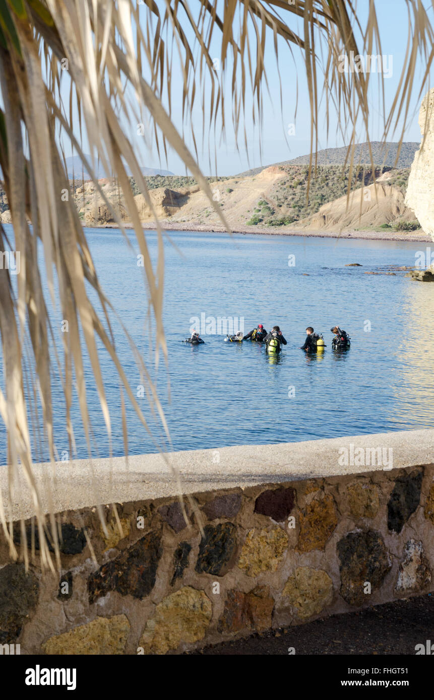 Group of scuba divers in the harbour at Isleta del Moro, in the Cabo de Gata National Park, Nijar, Almeria, Spain Stock Photo