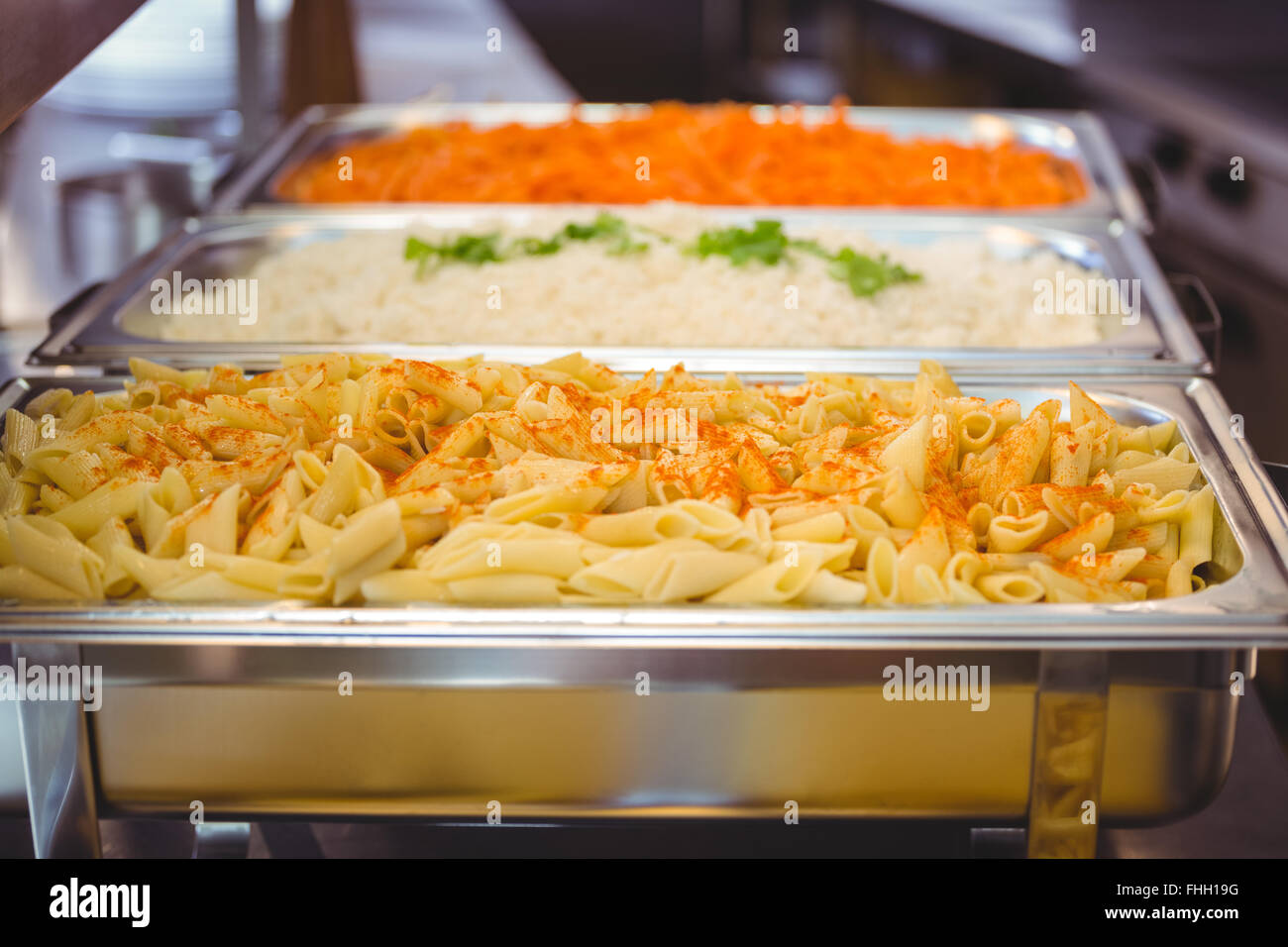 Serving dishes of potato and pasta Stock Photo