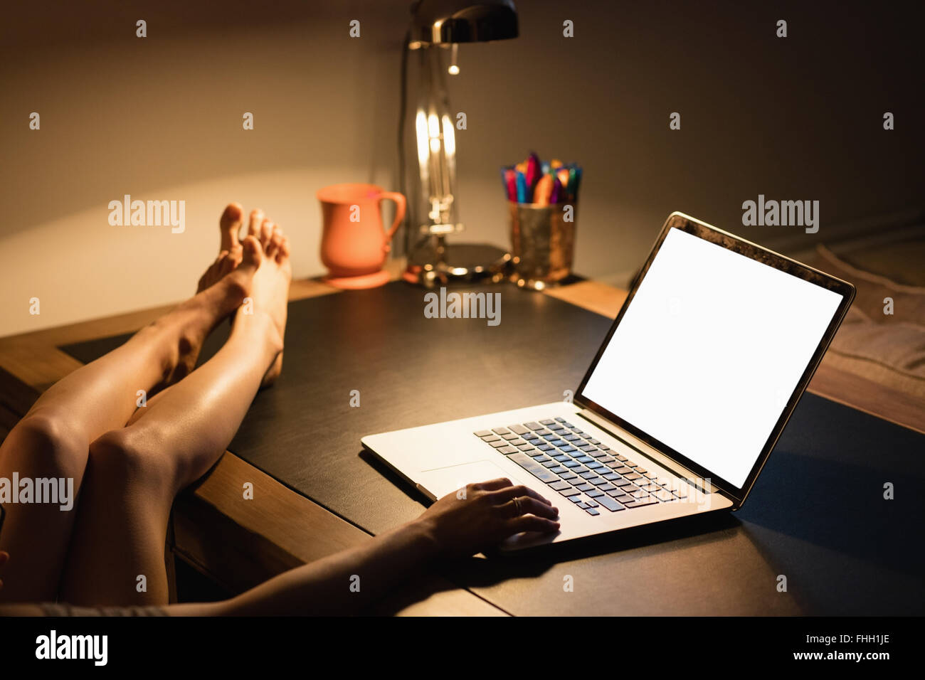 Feet on desk woman hi-res stock photography and images - Alamy
