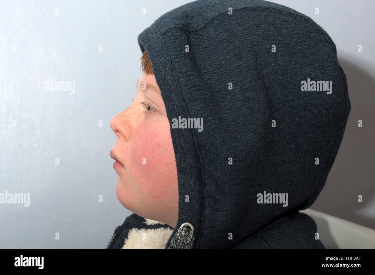 10year old boy wearing a hooded top Stock Photo Alamy