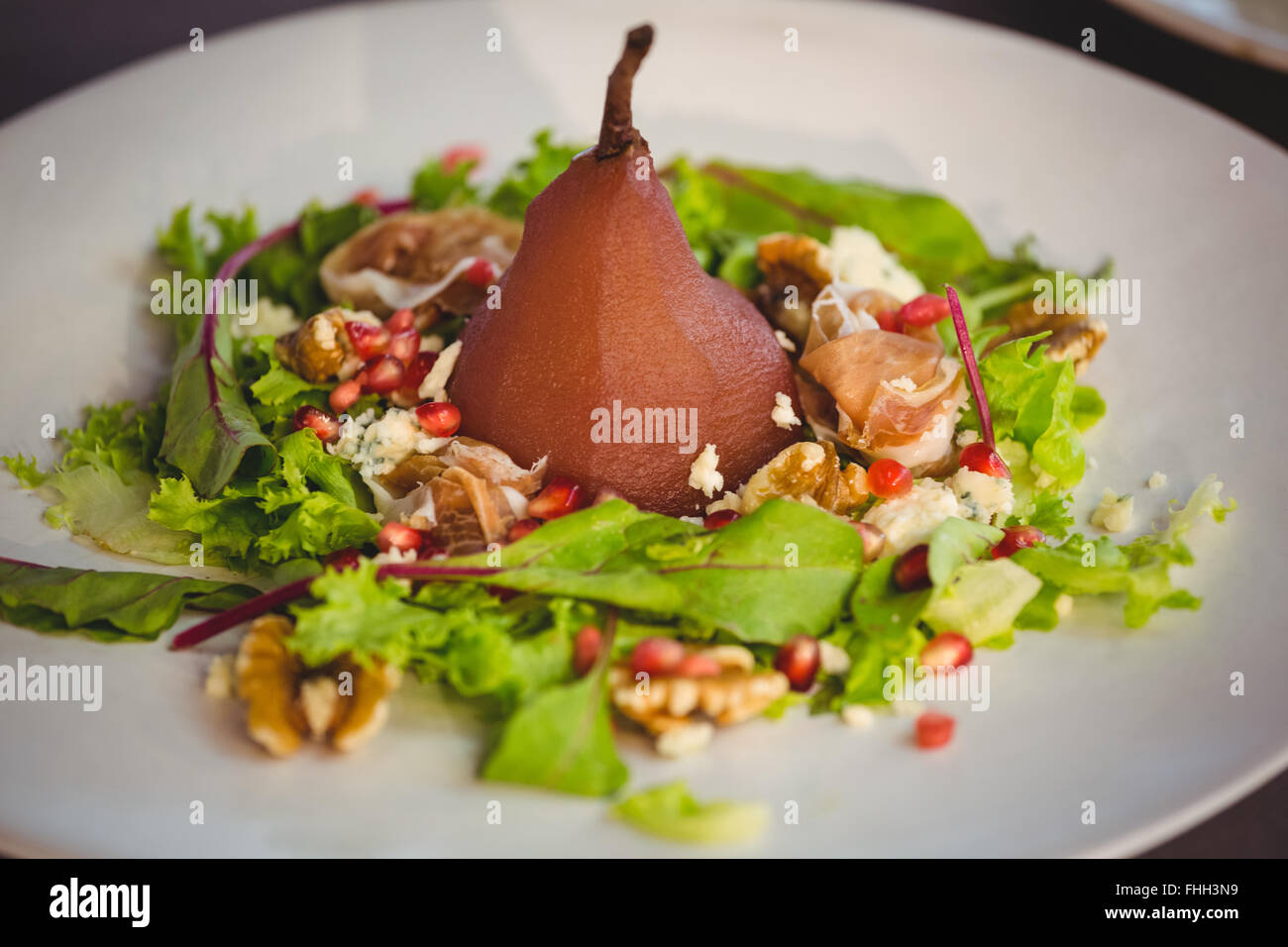 Poached pear with salad Stock Photo