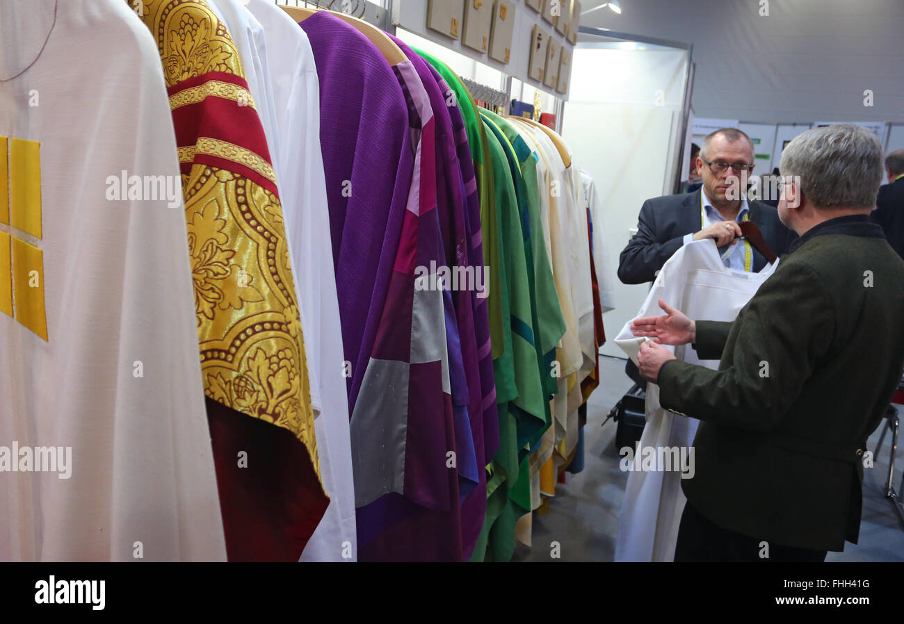 Augsburg, Germany. 25th Feb, 2016. Liturgical vestments are offered at a booth at the Gloria church trade fair in Augsburg, Germany, 25 February 2016. This is largest trade fair for church-related requisites in the German-speaking world. Photo: KARL-JOSEF HILDENBRAND/dpa/Alamy Live News Stock Photo