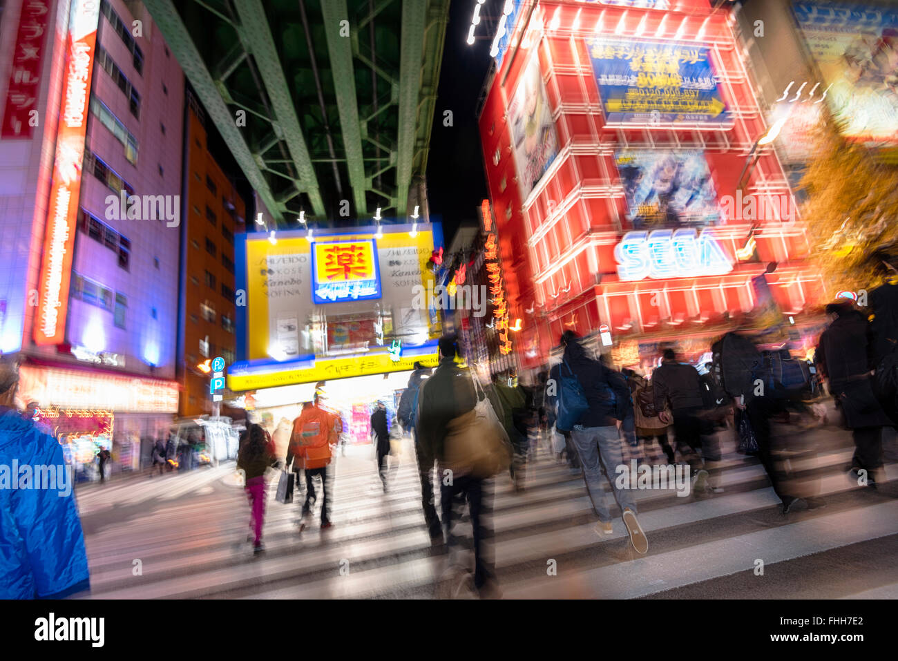Tokyo, Japan -January 8, 2016: Abstract image of commuters in the streets of Akibahara. Stock Photo