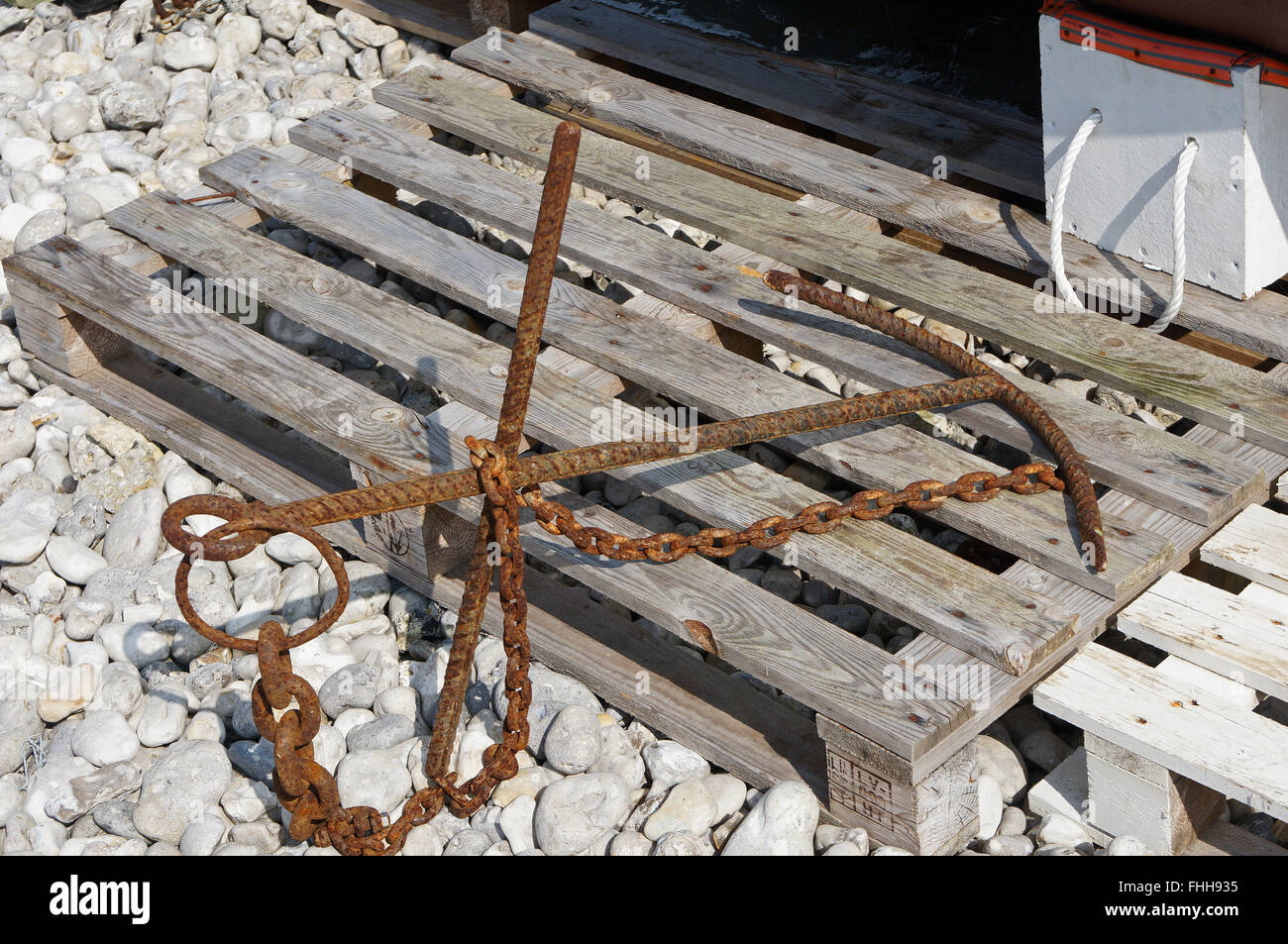 Rusty anchor on the beach of Yport, Normandy, France Stock Photo