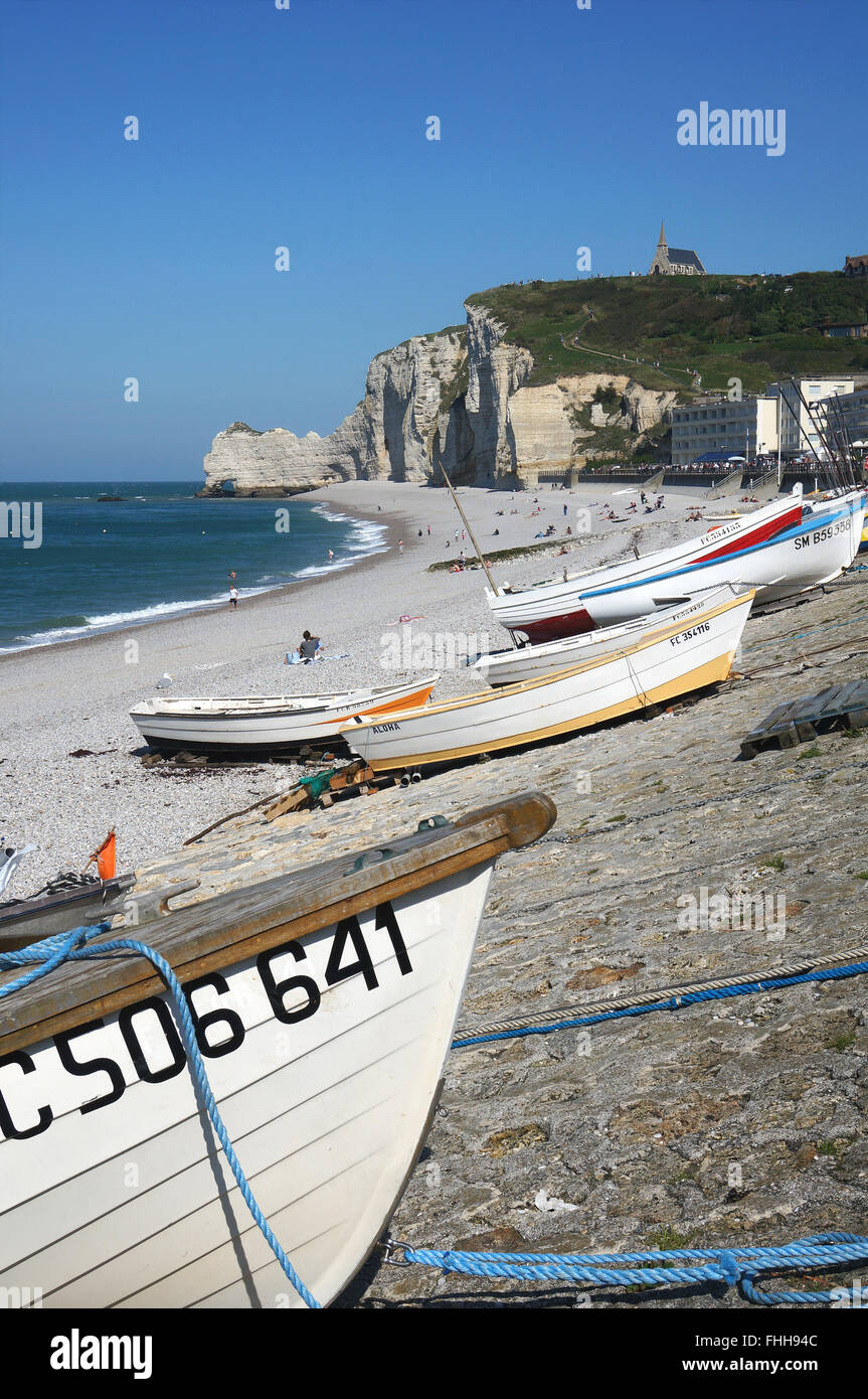 Etretat, Normandy, the beach with fishing boats and white cliffs Stock ...