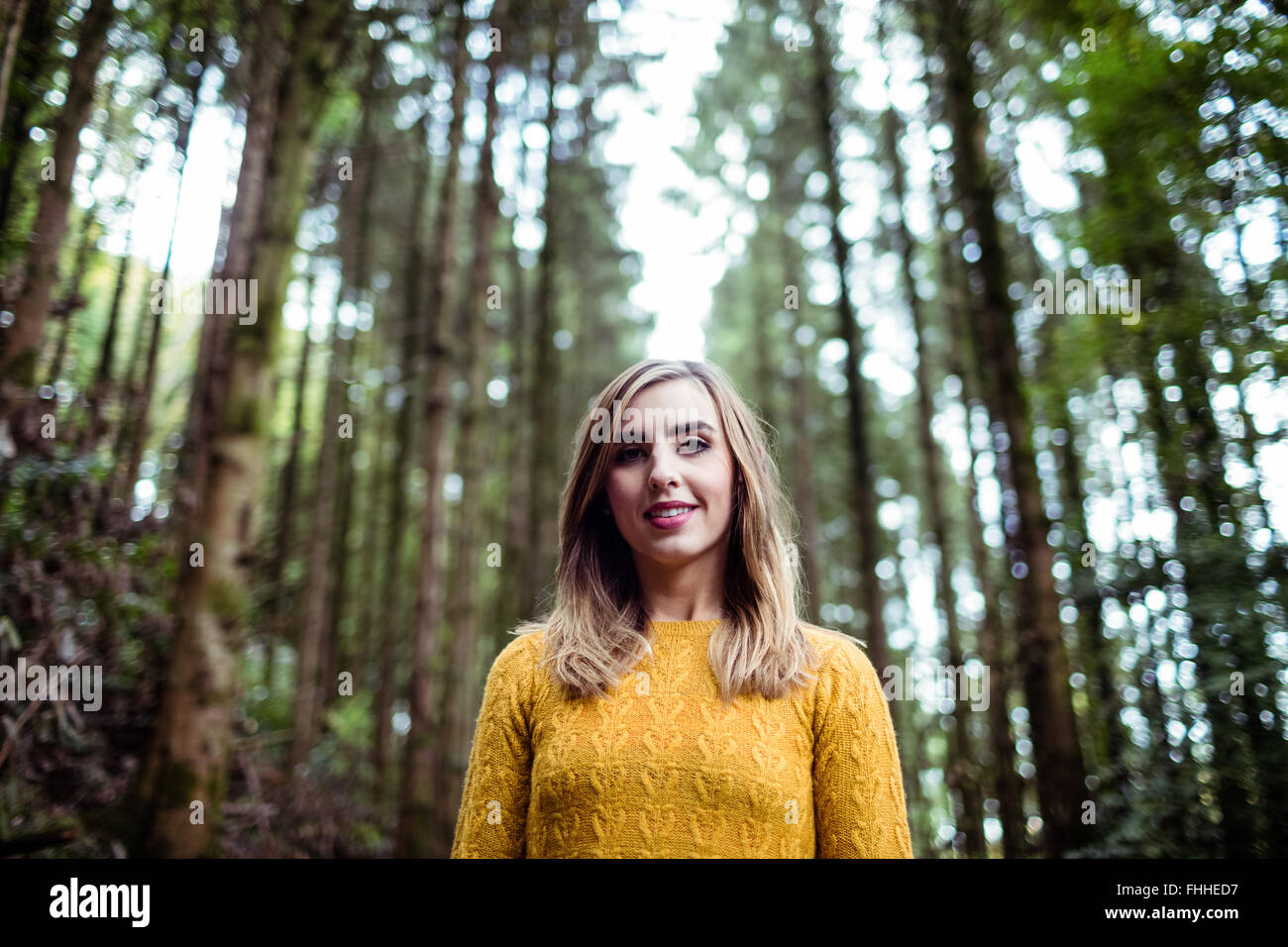 Pretty blonde woman smiling at camera Stock Photo - Alamy