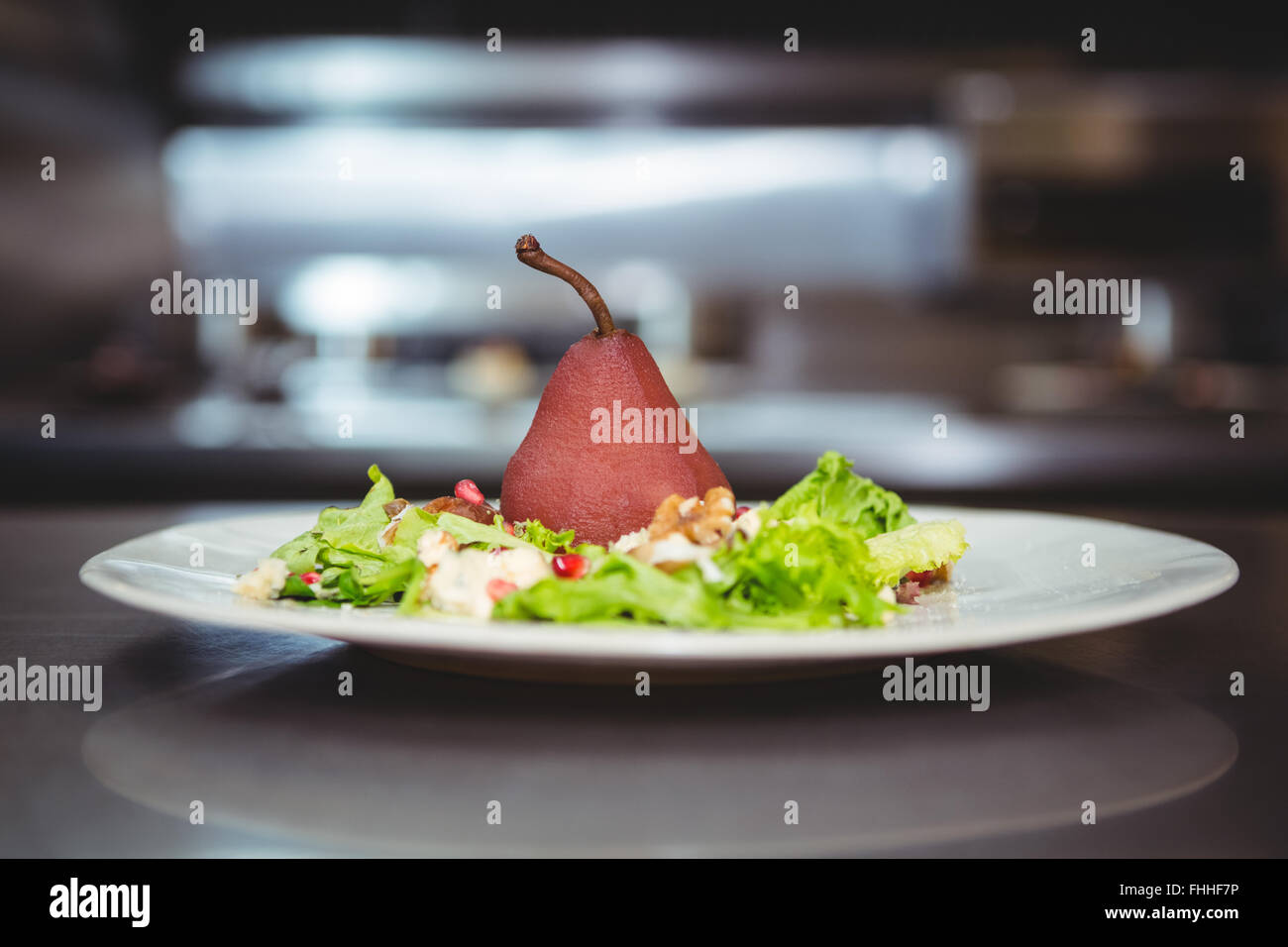 Poached pear with salad Stock Photo