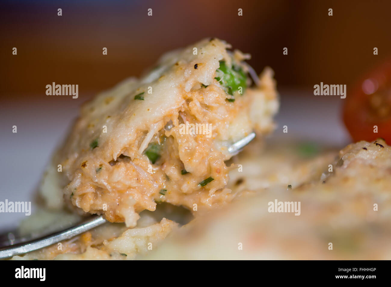 Crab pie on fork. French restaurant prepared dish with crab meat