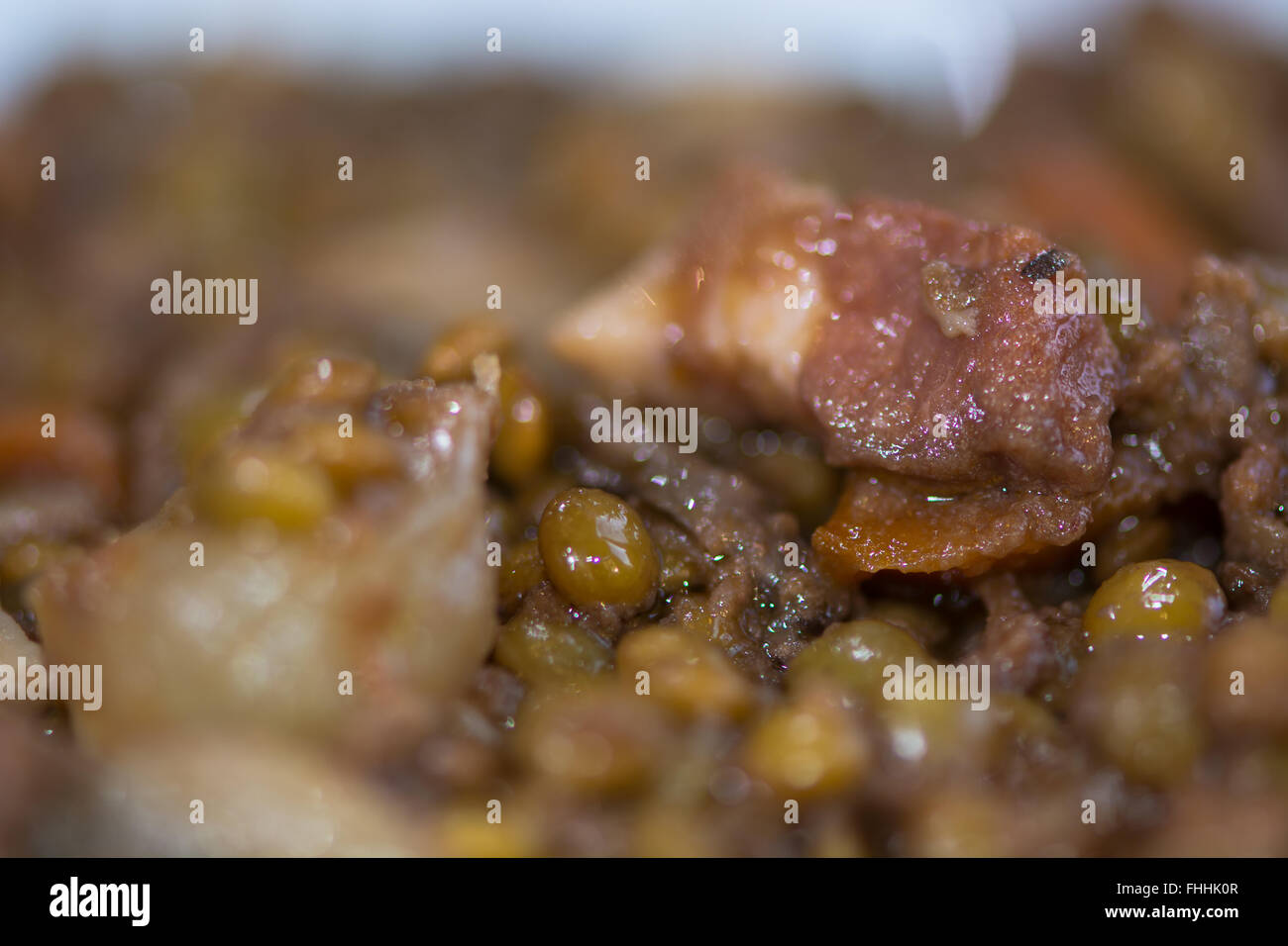 Green lentils with vegetables and bacon. French restaurant prepared dish with lentils, carrots